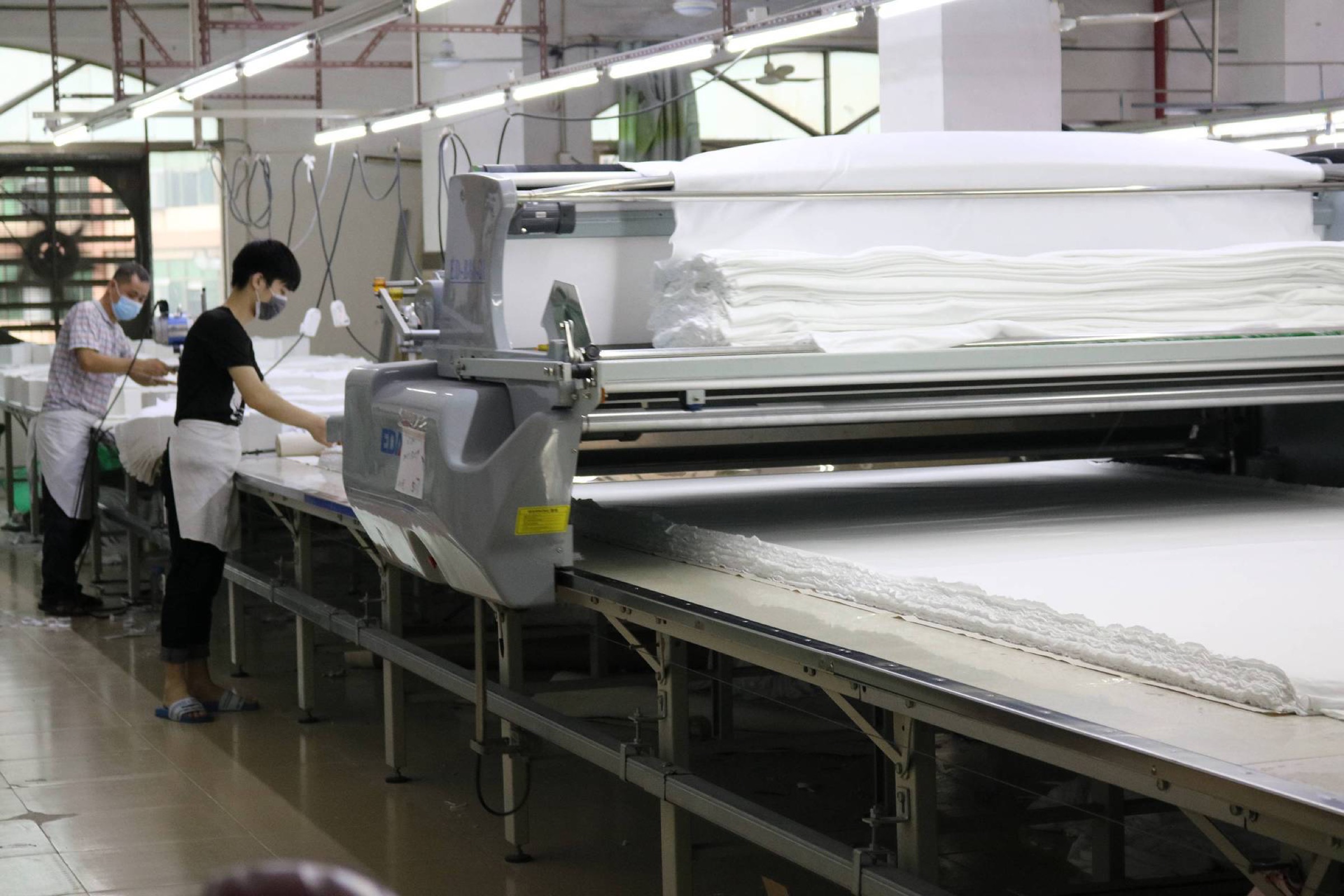 Fabric cutting table and cutting equipment in a garment production area