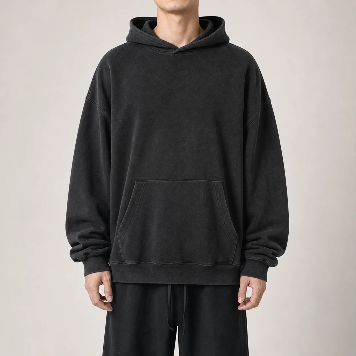 Oversized drop-shoulder hoodie on a model