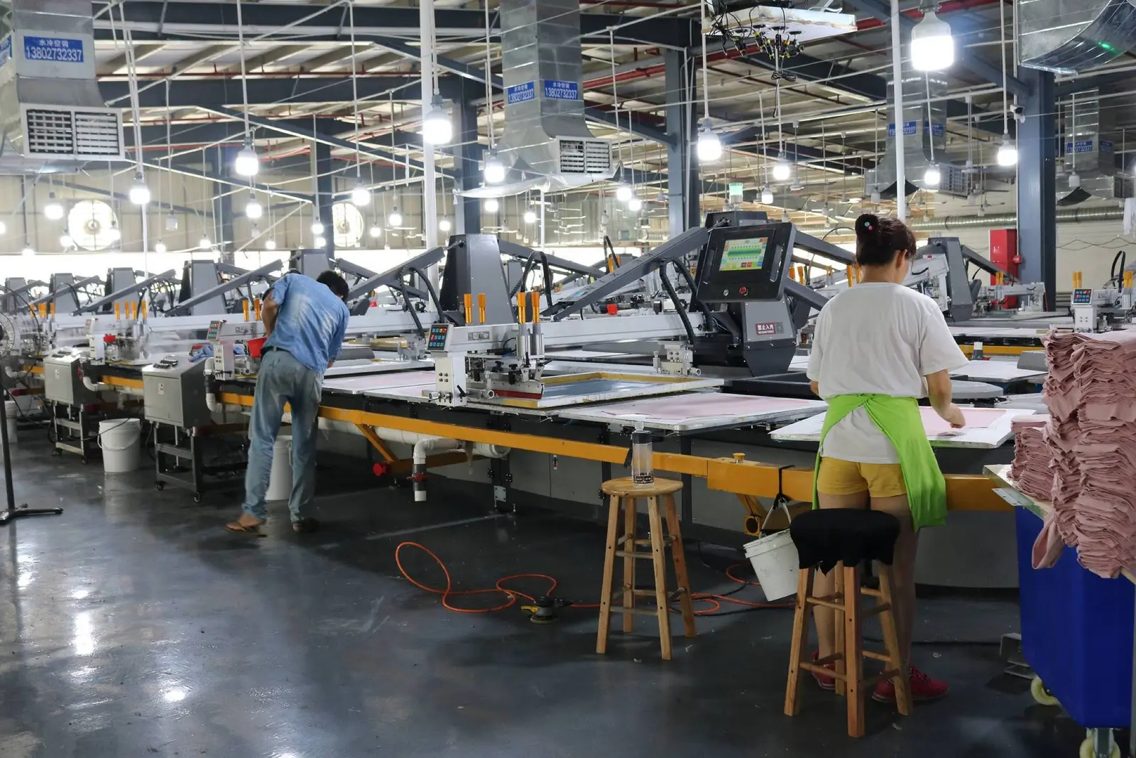 Carousel screen-printing line set up for garment printing in the production workshop